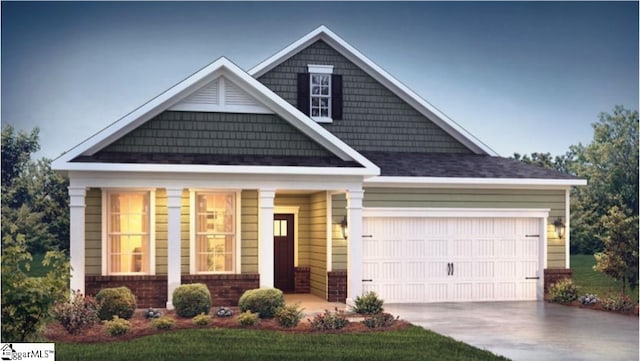 craftsman-style house featuring a front yard and a garage