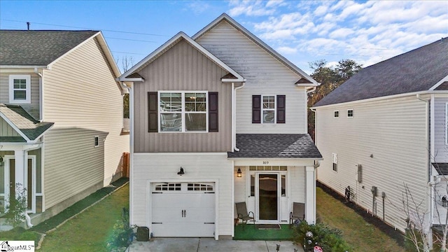 view of front facade with a front yard and a garage