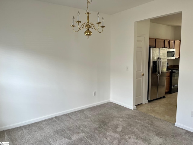 interior space featuring light carpet and an inviting chandelier