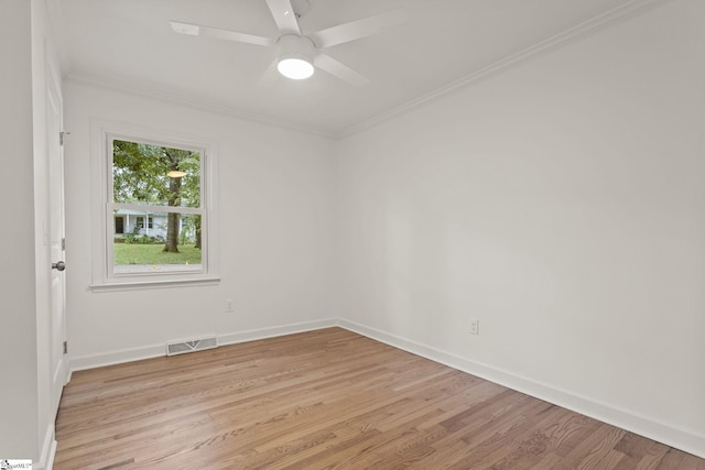 unfurnished room with crown molding, ceiling fan, and light hardwood / wood-style floors