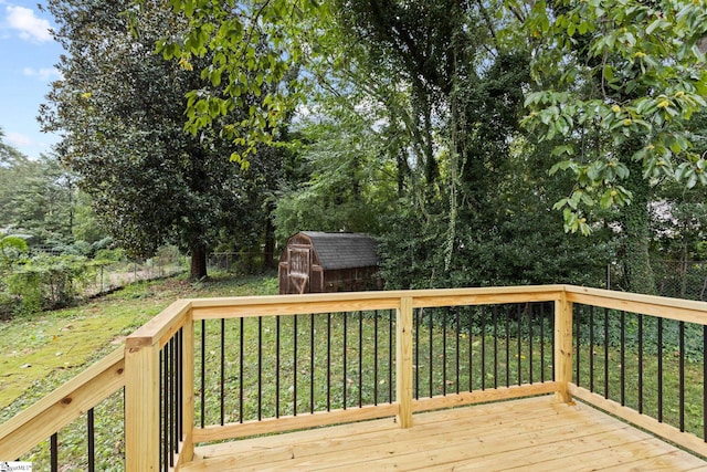 deck with a yard and a storage unit