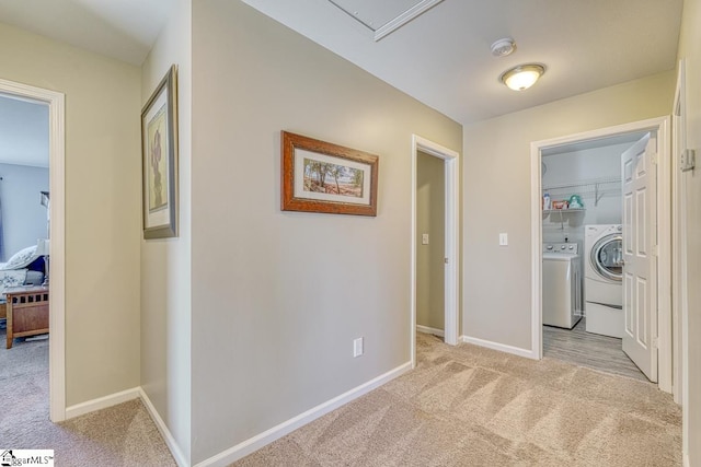 corridor featuring light colored carpet