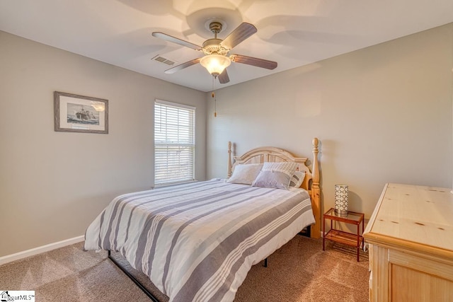 bedroom with ceiling fan and carpet floors