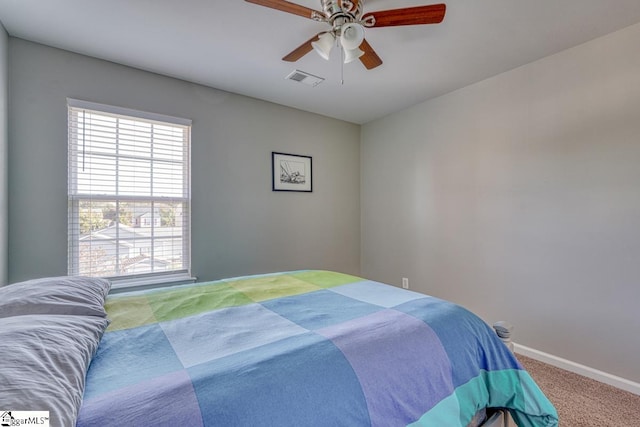 carpeted bedroom with ceiling fan