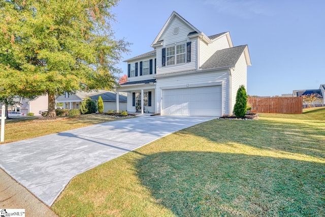 view of front property with a front yard and a garage