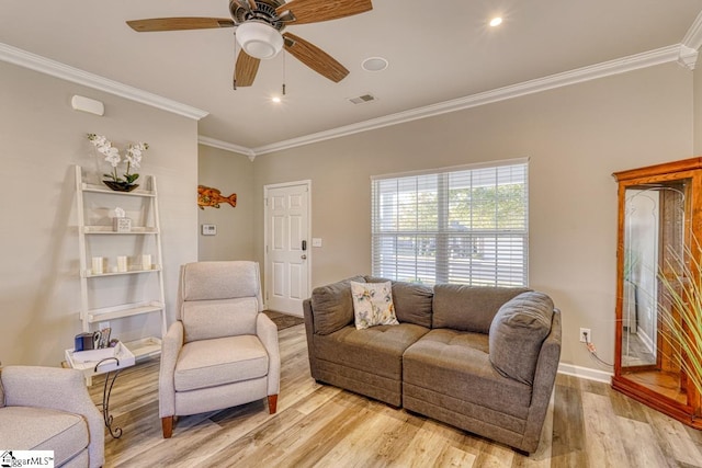 living room featuring ceiling fan, light hardwood / wood-style floors, and ornamental molding