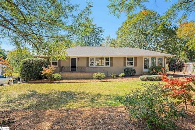 ranch-style home with a front lawn