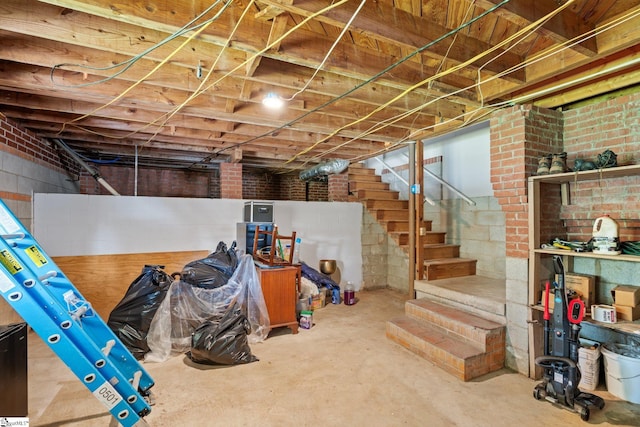 basement with brick wall