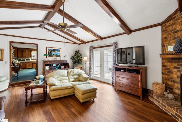 living room with french doors, lofted ceiling with beams, ceiling fan, a textured ceiling, and dark hardwood / wood-style flooring