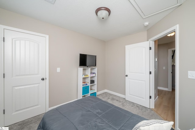 carpeted bedroom featuring a textured ceiling