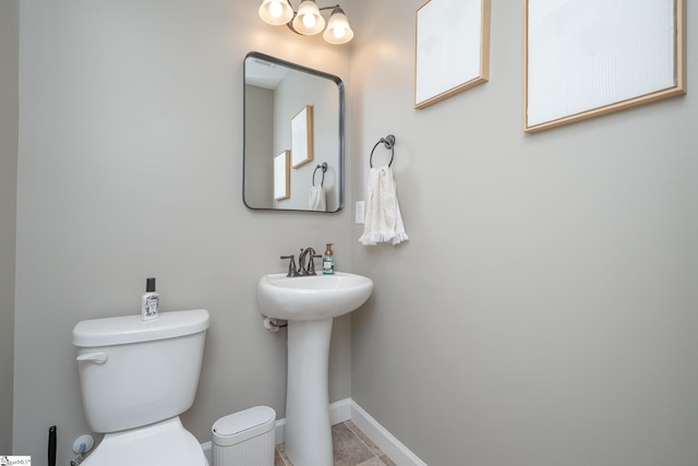 bathroom with sink, tile patterned flooring, and toilet