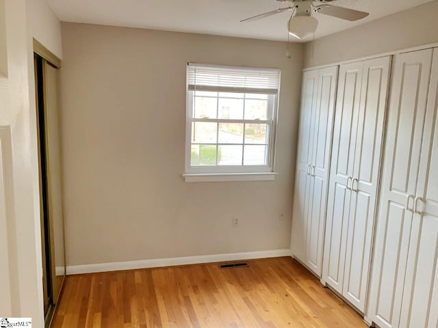 unfurnished bedroom featuring ceiling fan and light hardwood / wood-style flooring