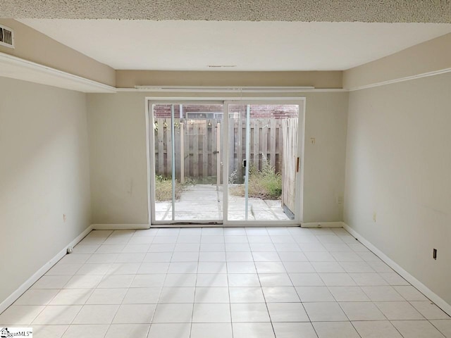 view of tiled spare room