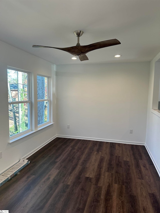 empty room with dark hardwood / wood-style flooring