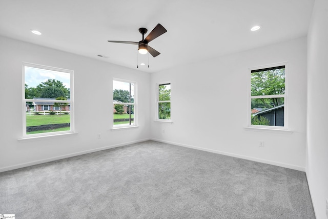 carpeted empty room with ceiling fan