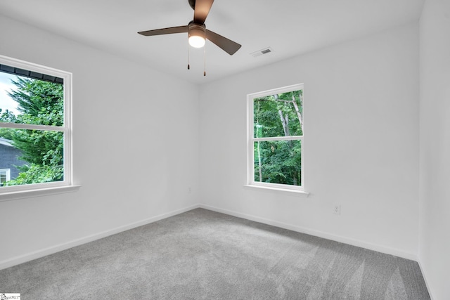 carpeted empty room with ceiling fan