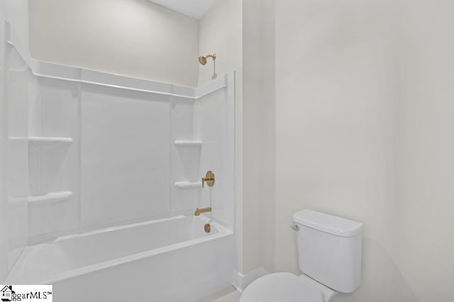 bathroom featuring toilet and shower / bath combination