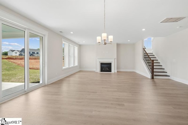 115 Pipet Rd Unit 14, Piedmont, SC 29673 - unfurnished living room with light wood finished floors, a chandelier, stairs, and recessed lighting