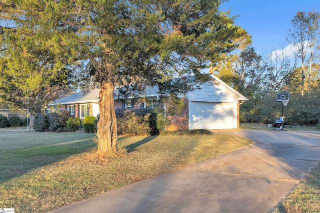 view of front of house with a front yard and a garage