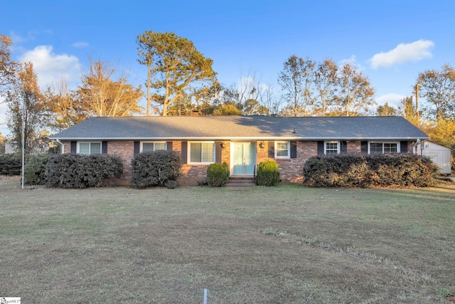 ranch-style home featuring a front yard