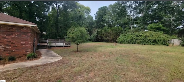 view of yard featuring a wooden deck