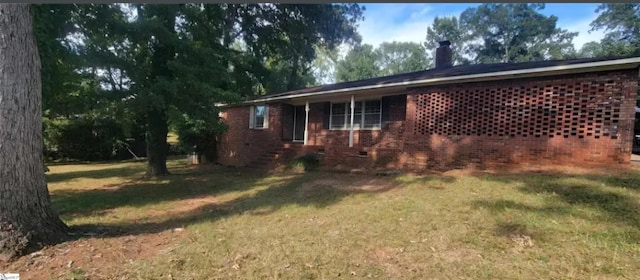 view of property exterior with a yard