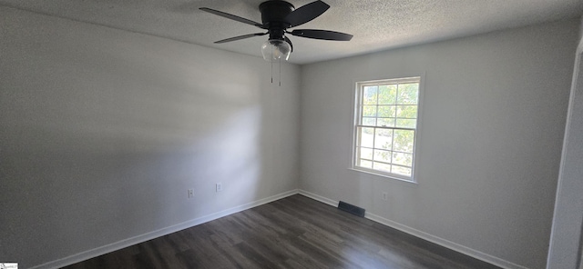 unfurnished room with ceiling fan and dark hardwood / wood-style flooring