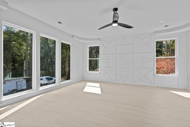 interior space featuring ceiling fan