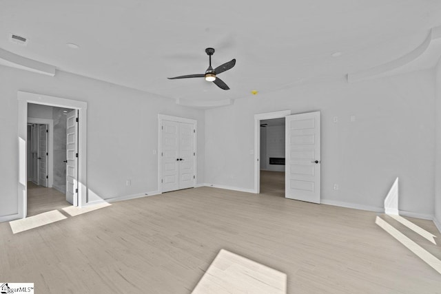 interior space featuring a closet, light hardwood / wood-style floors, and ceiling fan