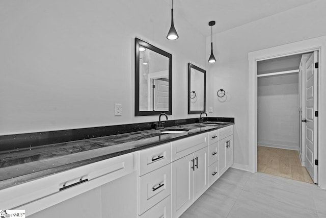 bathroom featuring hardwood / wood-style flooring and vanity