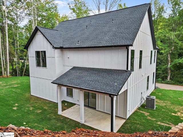 back of property featuring a lawn, a patio area, and central AC