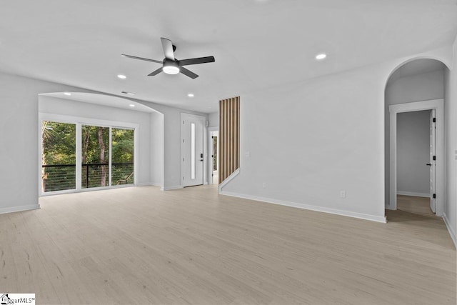 unfurnished living room with ceiling fan and light wood-type flooring