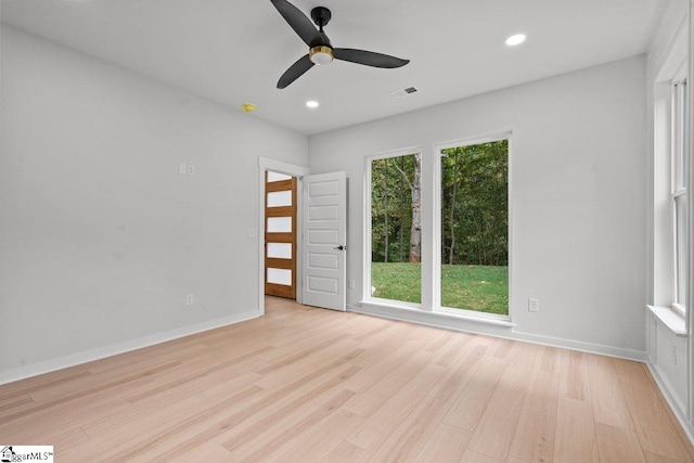 unfurnished room with light hardwood / wood-style flooring and ceiling fan