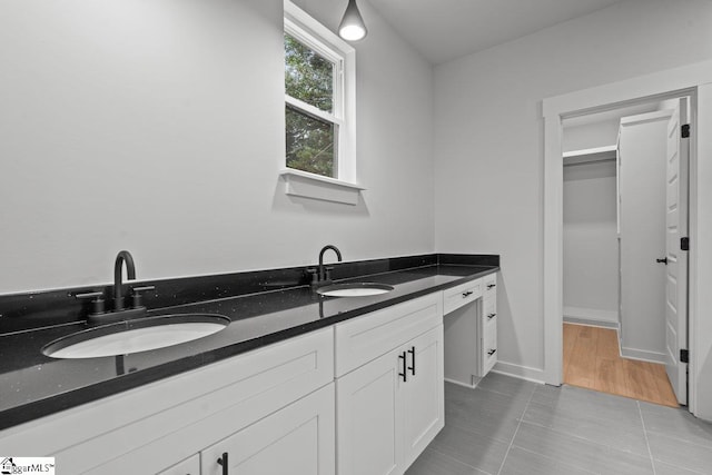 bathroom featuring tile patterned floors and vanity