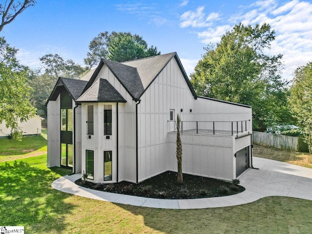 view of outbuilding featuring a lawn