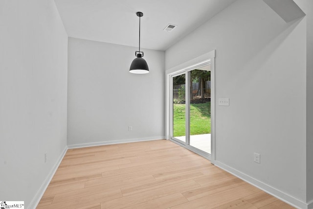 unfurnished dining area with light hardwood / wood-style flooring