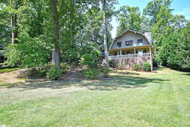 view of yard featuring a porch