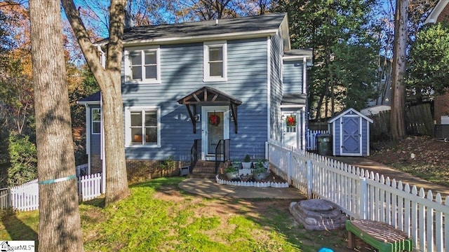 view of front of house featuring a shed