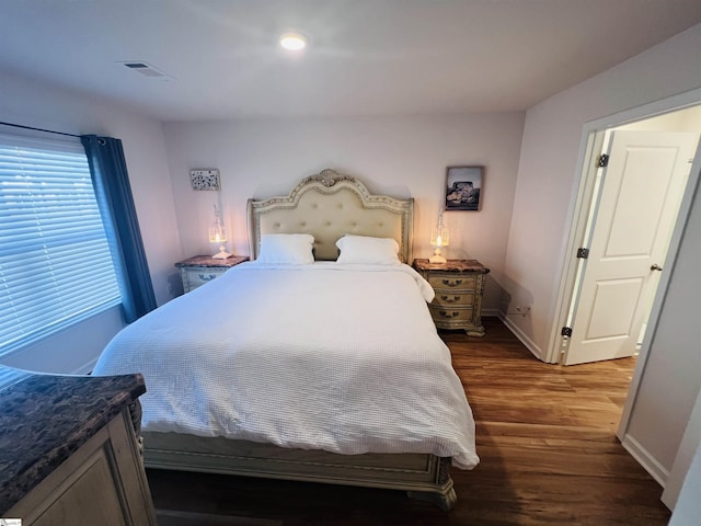 bedroom featuring dark hardwood / wood-style floors