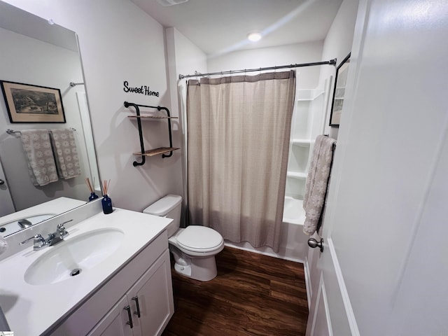 full bathroom featuring hardwood / wood-style floors, vanity, toilet, and shower / bath combo with shower curtain