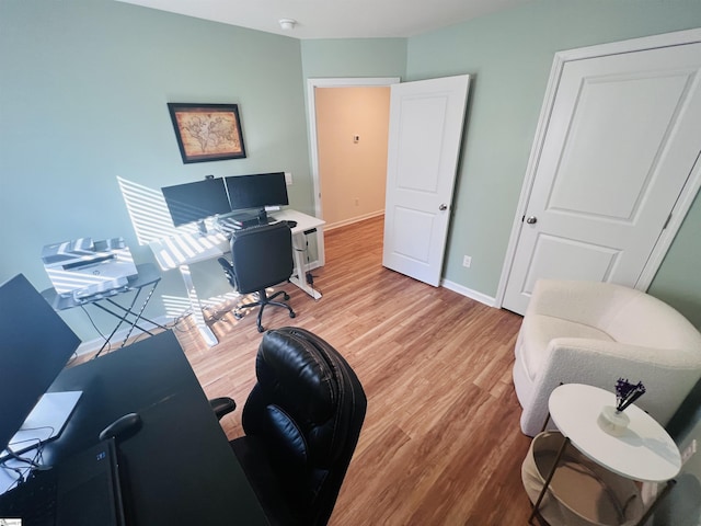 office area with wood-type flooring