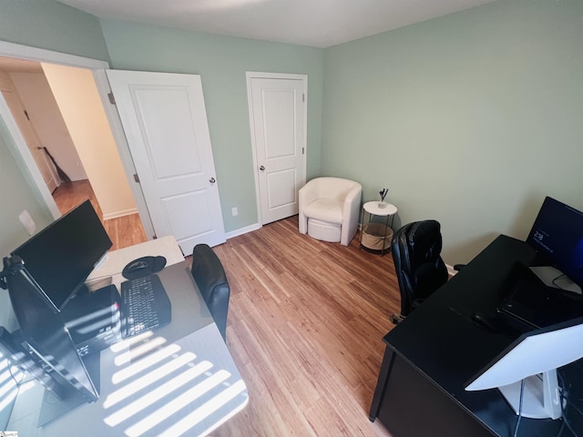 office area with wood-type flooring