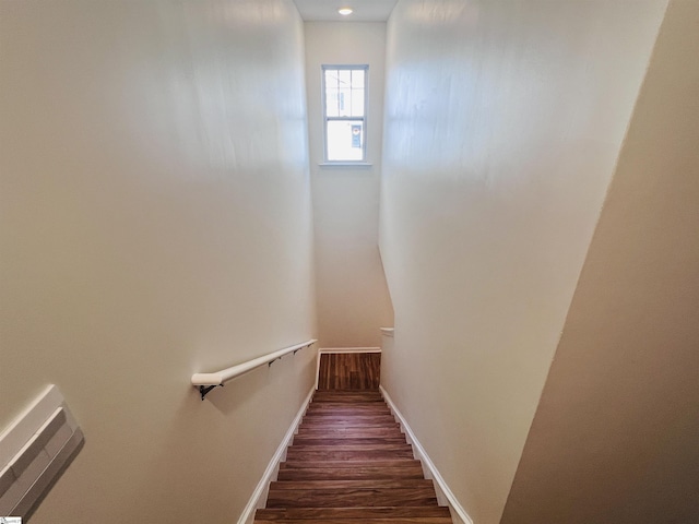 stairs with wood-type flooring