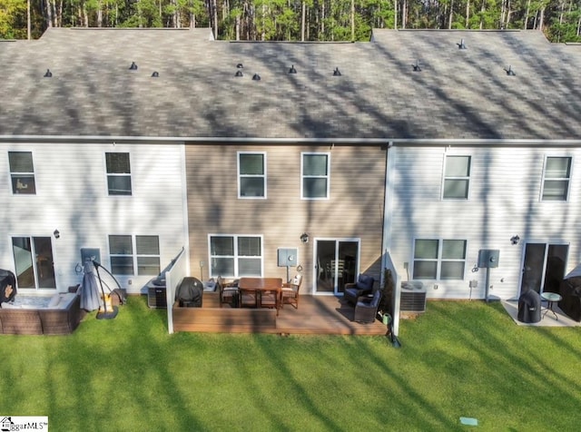 back of property with a lawn, central AC unit, an outdoor hangout area, and a wooden deck