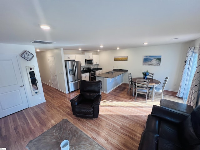 living room with light hardwood / wood-style floors