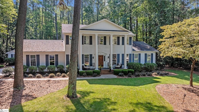 neoclassical / greek revival house with a front lawn