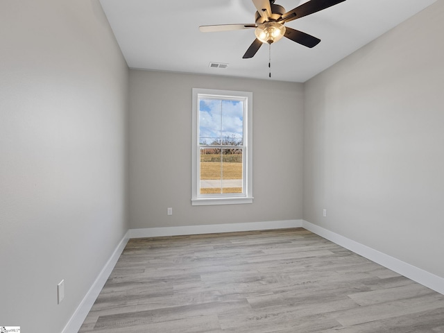 unfurnished room featuring light wood-type flooring and ceiling fan