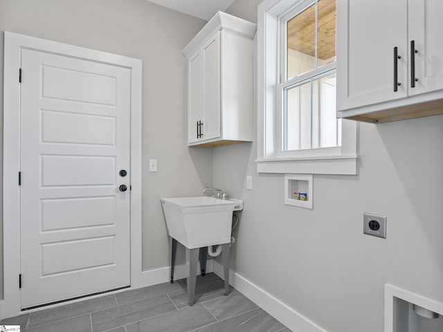 laundry room with hookup for a washing machine, cabinets, and hookup for an electric dryer