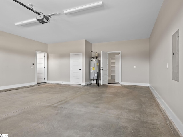 garage with a garage door opener, electric water heater, and electric panel