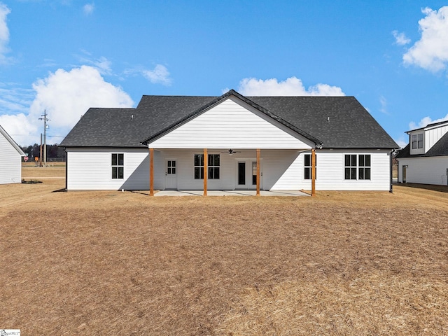 back of house with ceiling fan and a patio